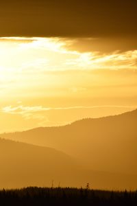 Preview wallpaper hills, grass, sun, sunset, sky