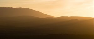 Preview wallpaper hills, grass, sunrise, light, nature