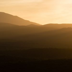 Preview wallpaper hills, grass, sunrise, light, nature