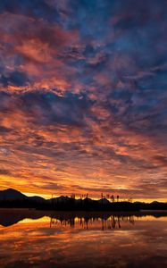 Preview wallpaper hills, lake, water, sunset, evening
