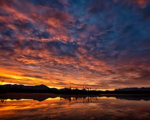 Preview wallpaper hills, lake, water, sunset, evening