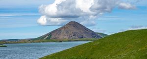 Preview wallpaper hills, landscape, mountain, sea, flowers