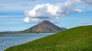 Preview wallpaper hills, landscape, mountain, sea, flowers