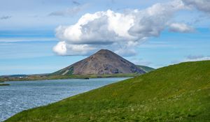 Preview wallpaper hills, landscape, mountain, sea, flowers