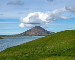 Preview wallpaper hills, landscape, mountain, sea, flowers