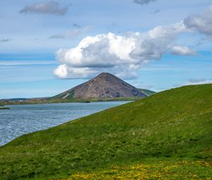 Preview wallpaper hills, landscape, mountain, sea, flowers