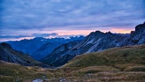 Preview wallpaper hills, mountains, clouds, sky, sunset, landscape