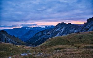 Preview wallpaper hills, mountains, clouds, sky, sunset, landscape