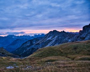 Preview wallpaper hills, mountains, clouds, sky, sunset, landscape