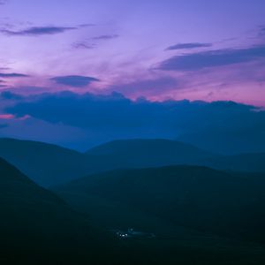 Preview wallpaper hills, mountains, clouds, twilight, light, dark