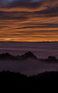 Preview wallpaper hills, mountains, clouds, horizon, sunset