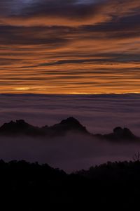 Preview wallpaper hills, mountains, clouds, horizon, sunset