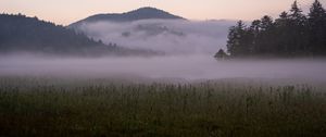 Preview wallpaper hills, mountains, fog, field, grass, landscape