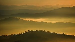 Preview wallpaper hills, mountains, fog, clouds, trees, sky