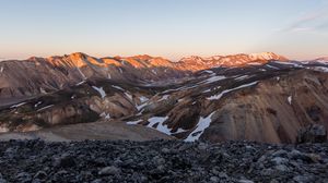 Preview wallpaper hills, mountains, snow, stones, nature