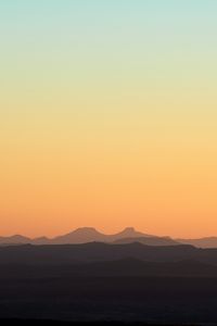 Preview wallpaper hills, mountains, sunset, sky, distance