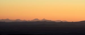 Preview wallpaper hills, mountains, sunset, sky, distance