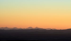 Preview wallpaper hills, mountains, sunset, sky, distance