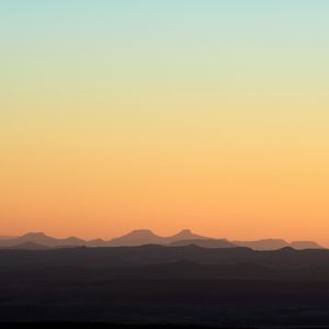 Preview wallpaper hills, mountains, sunset, sky, distance
