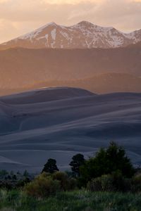 Preview wallpaper hills, mountains, trees, relief, snow