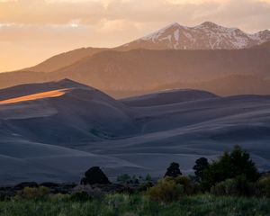 Preview wallpaper hills, mountains, trees, relief, snow