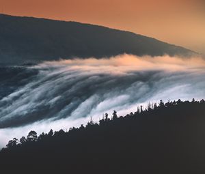 Preview wallpaper hills, mountains, trees, clouds, landscape, sunset