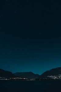 Preview wallpaper hills, night, starry sky, stars, sea