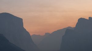 Preview wallpaper hills, peaks, fog, forest, sunset