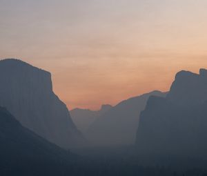 Preview wallpaper hills, peaks, fog, forest, sunset