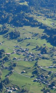 Preview wallpaper hills, relief, trees, houses, aerial view