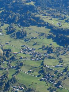 Preview wallpaper hills, relief, trees, houses, aerial view