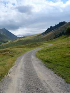 Preview wallpaper hills, road, grass, nature, landscape