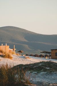 Preview wallpaper hills, sand, umbrellas, beach, nature