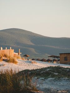 Preview wallpaper hills, sand, umbrellas, beach, nature