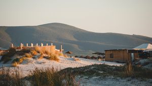 Preview wallpaper hills, sand, umbrellas, beach, nature