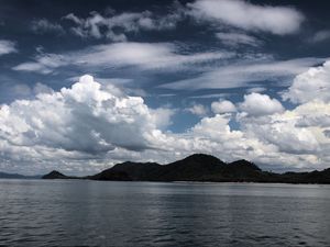 Preview wallpaper hills, sea, sky, clouds, nature