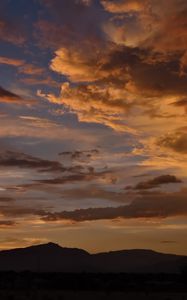 Preview wallpaper hills, silhouettes, clouds, sky, evening, nature