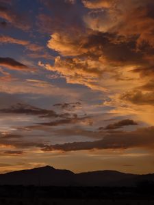 Preview wallpaper hills, silhouettes, clouds, sky, evening, nature