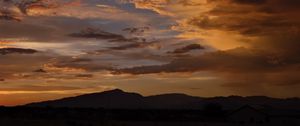 Preview wallpaper hills, silhouettes, clouds, sky, evening, nature