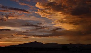 Preview wallpaper hills, silhouettes, clouds, sky, evening, nature