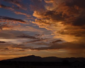 Preview wallpaper hills, silhouettes, clouds, sky, evening, nature