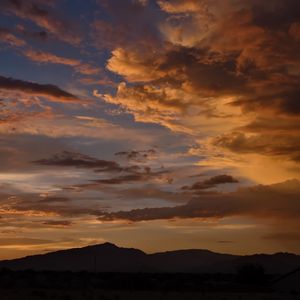 Preview wallpaper hills, silhouettes, clouds, sky, evening, nature