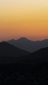 Preview wallpaper hills, silhouettes, mountains, sunrise, landscape