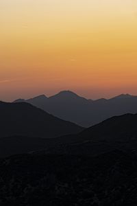 Preview wallpaper hills, silhouettes, mountains, sunrise, landscape