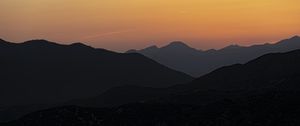 Preview wallpaper hills, silhouettes, mountains, sunrise, landscape