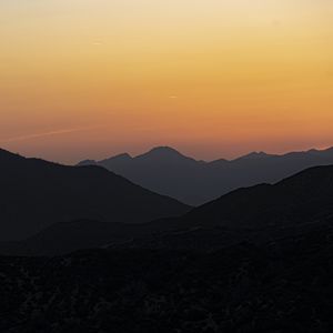 Preview wallpaper hills, silhouettes, mountains, sunrise, landscape