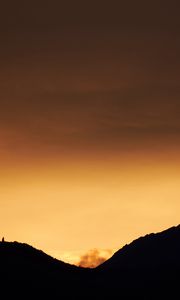 Preview wallpaper hills, silhouettes, sunset, sky, dusk, evening
