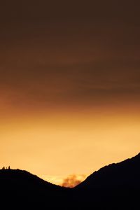 Preview wallpaper hills, silhouettes, sunset, sky, dusk, evening