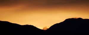 Preview wallpaper hills, silhouettes, sunset, sky, dusk, evening