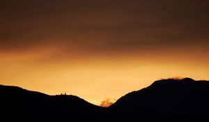 Preview wallpaper hills, silhouettes, sunset, sky, dusk, evening